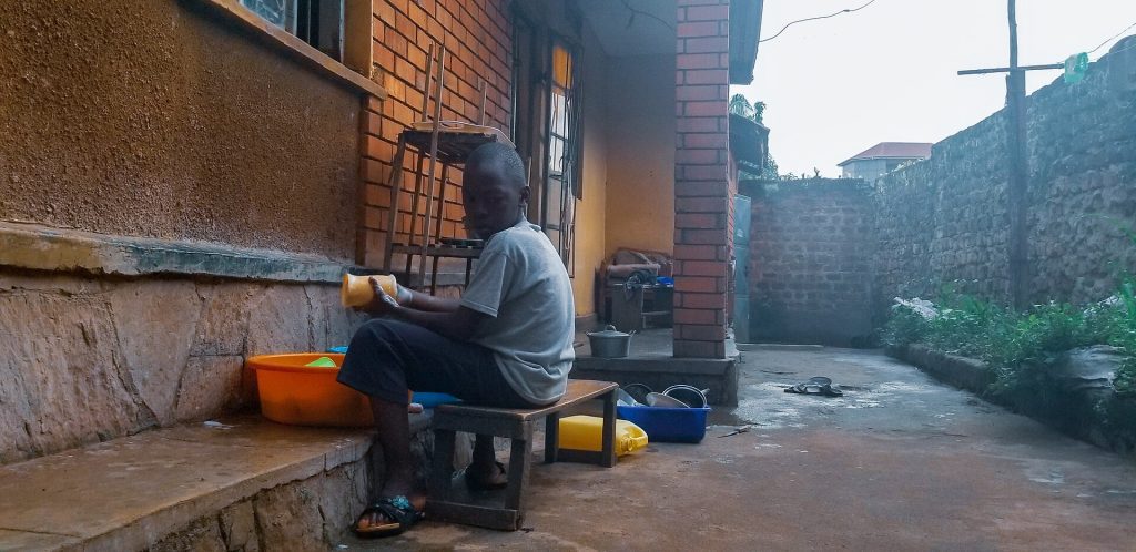 A family walking along a Kampala street