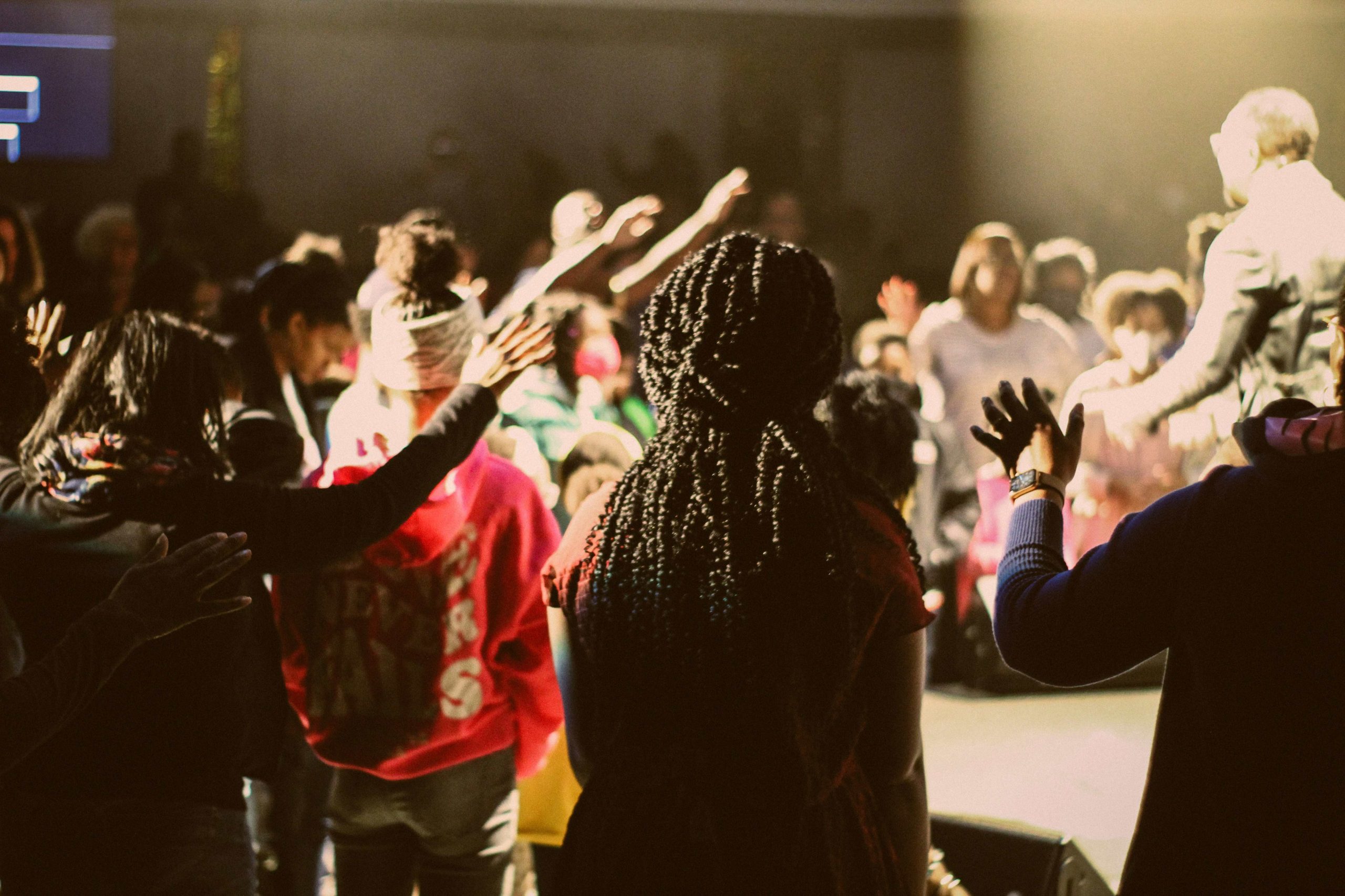 Hands lifted in worship during a praise service